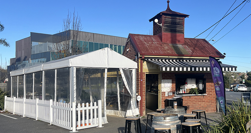 Small heritage brick building converted to a local cafe